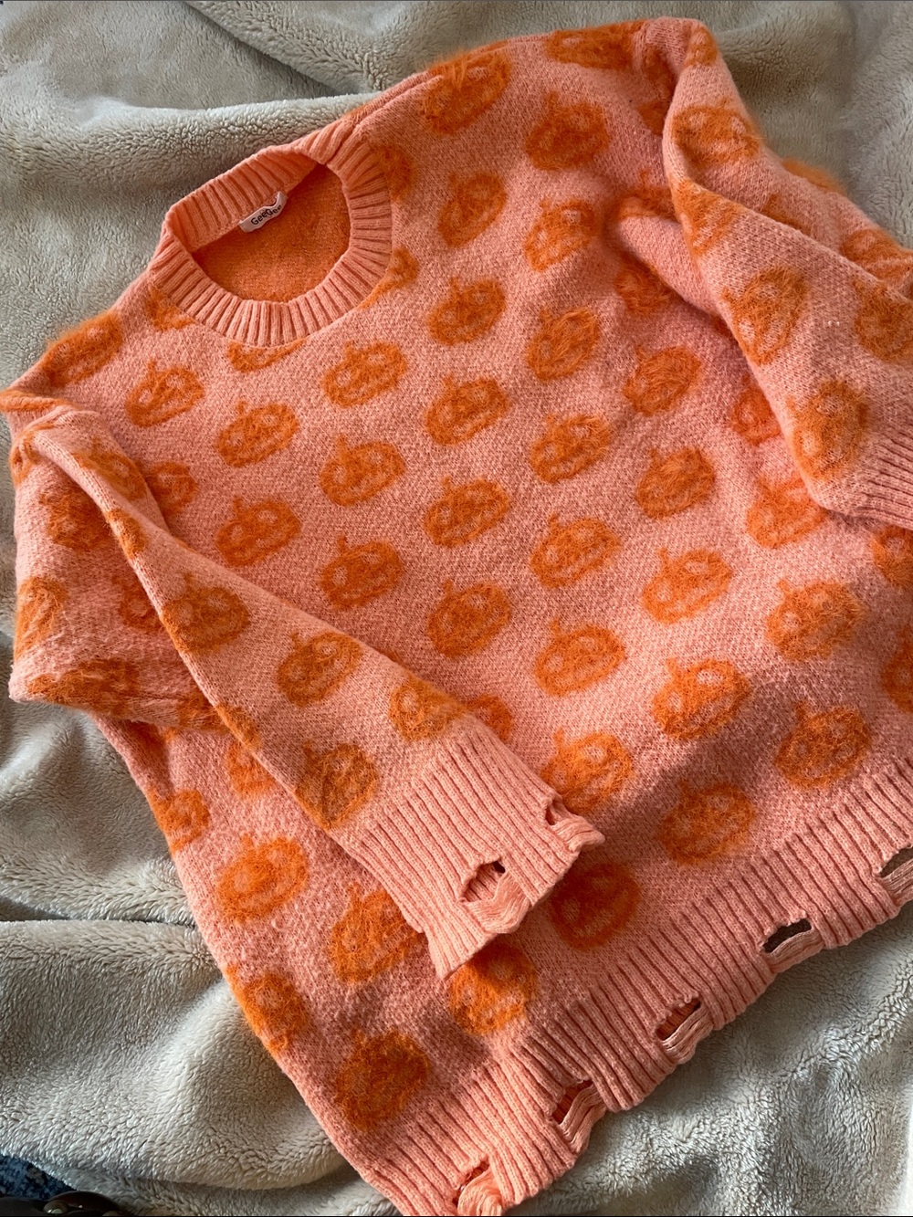 Cozy Pumpkin-Print Crewneck Sweater -A soft Orange with darker orange pumpkins.